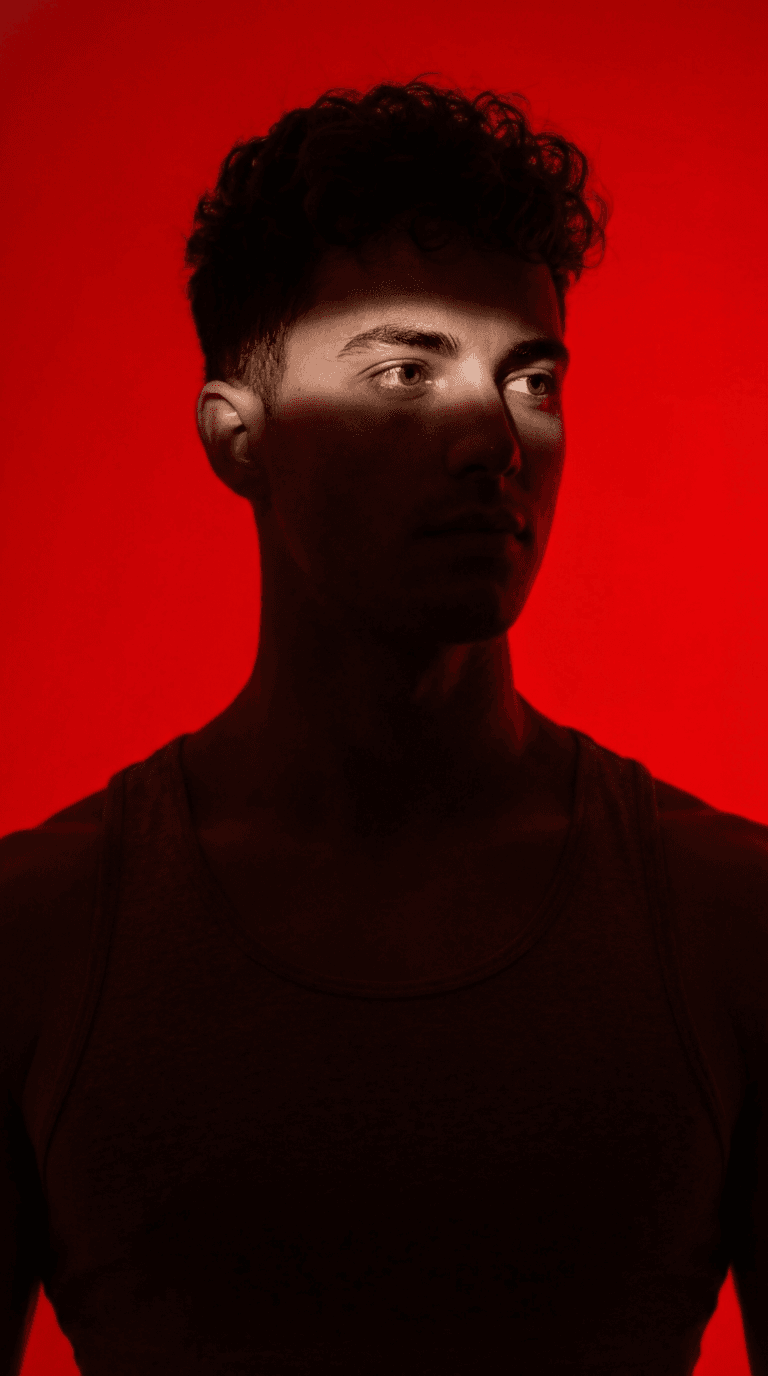 Dramatic Portrait With Red Background And Horizontal Light Strip